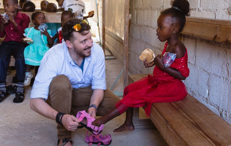 Mat Luce laughs with a young girl